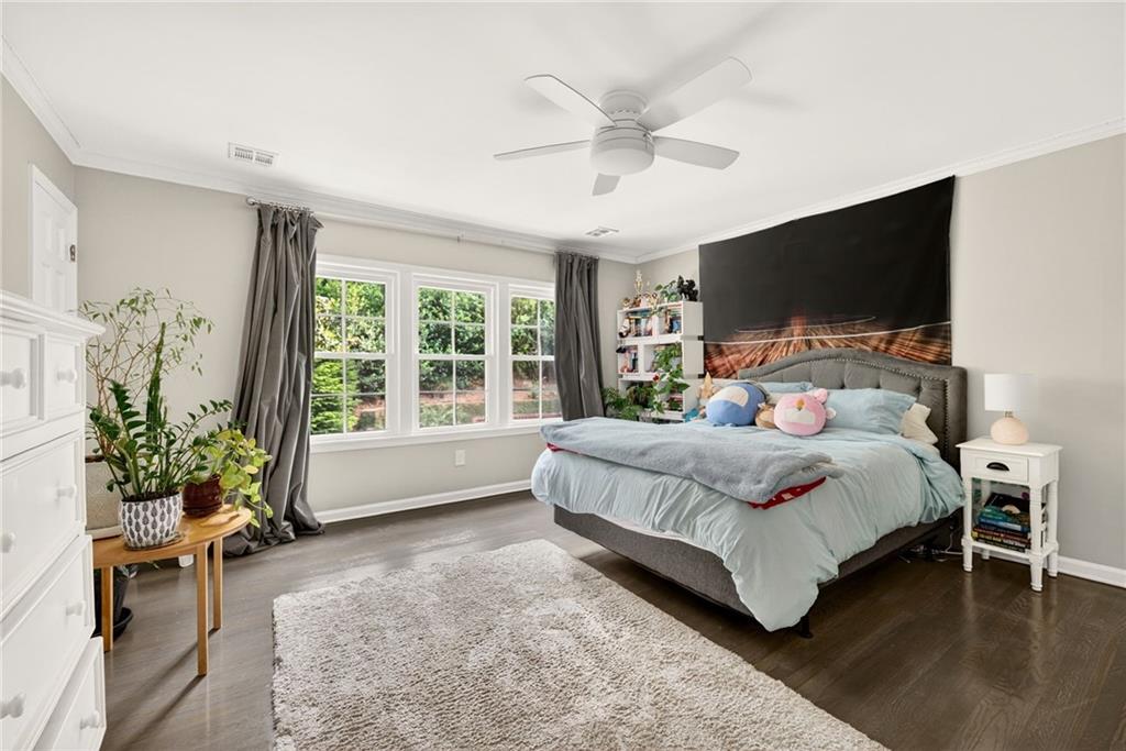 3650 Dumbarton Road Northwest Atlanta, GA 30327 - Photo 29 of 57 a bedroom with a large bed and a flat screen tv