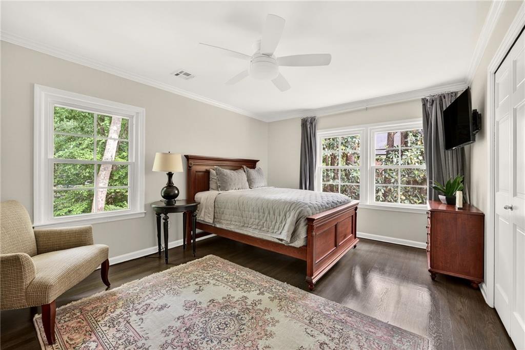 3650 Dumbarton Road Northwest Atlanta, GA 30327 - Photo 33 of 57 a bedroom with a large bed and a couch