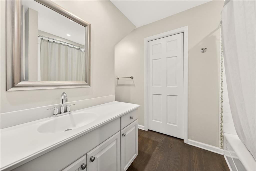 3650 Dumbarton Road Northwest Atlanta, GA 30327 - Photo 34 of 57 a bathroom with a sink and a mirror