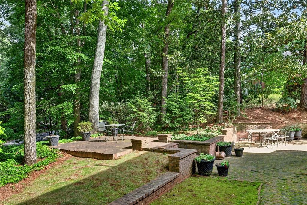 3650 Dumbarton Road Northwest Atlanta, GA 30327 - Photo 52 of 57 a view of backyard with swimming pool and outdoor seating