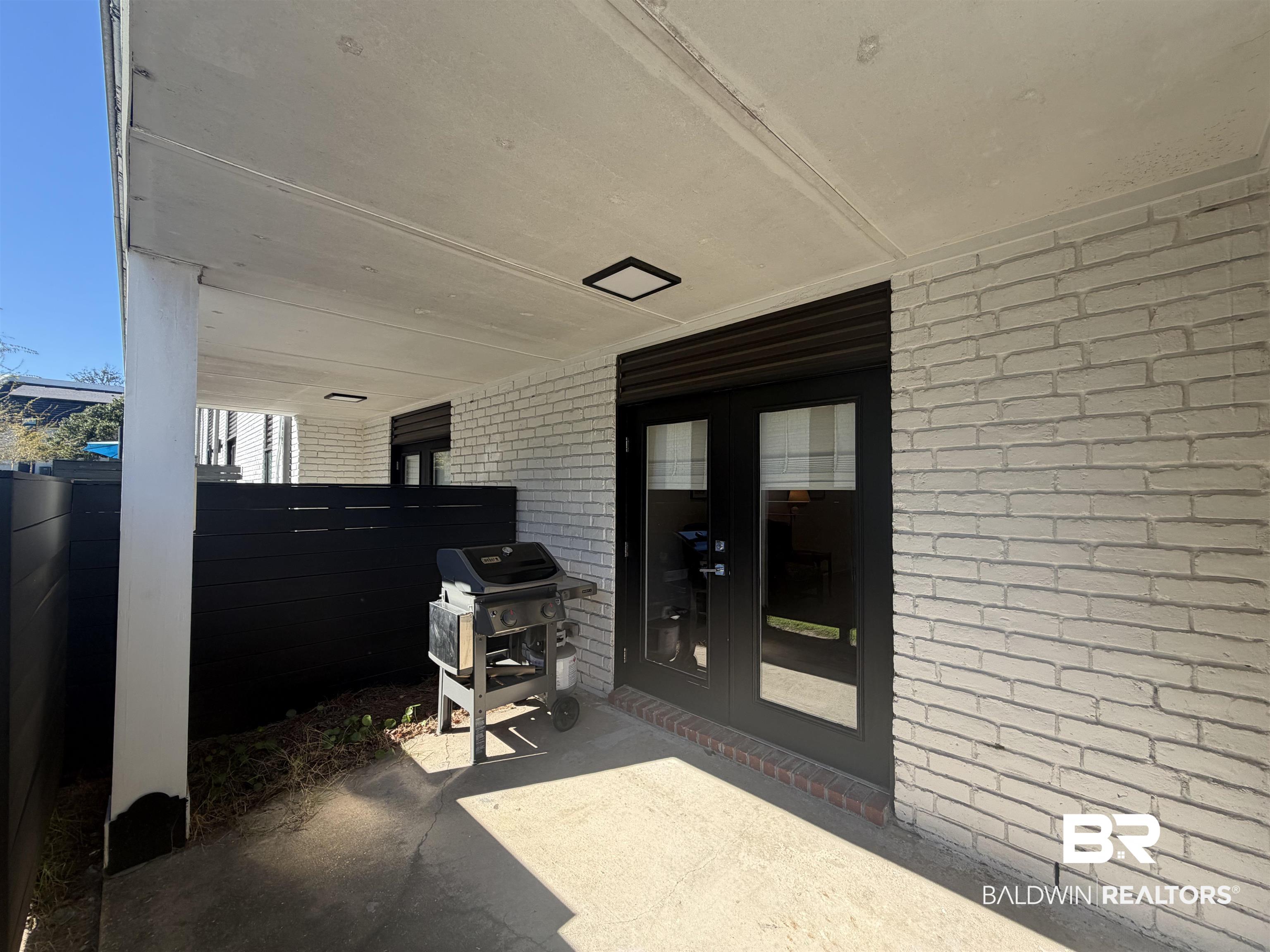 3655 Old Shell Road, Unit 219 Mobile, AL 36608 - Photo 13 of 25 View of patio / terrace featuring area for grilling and french doors