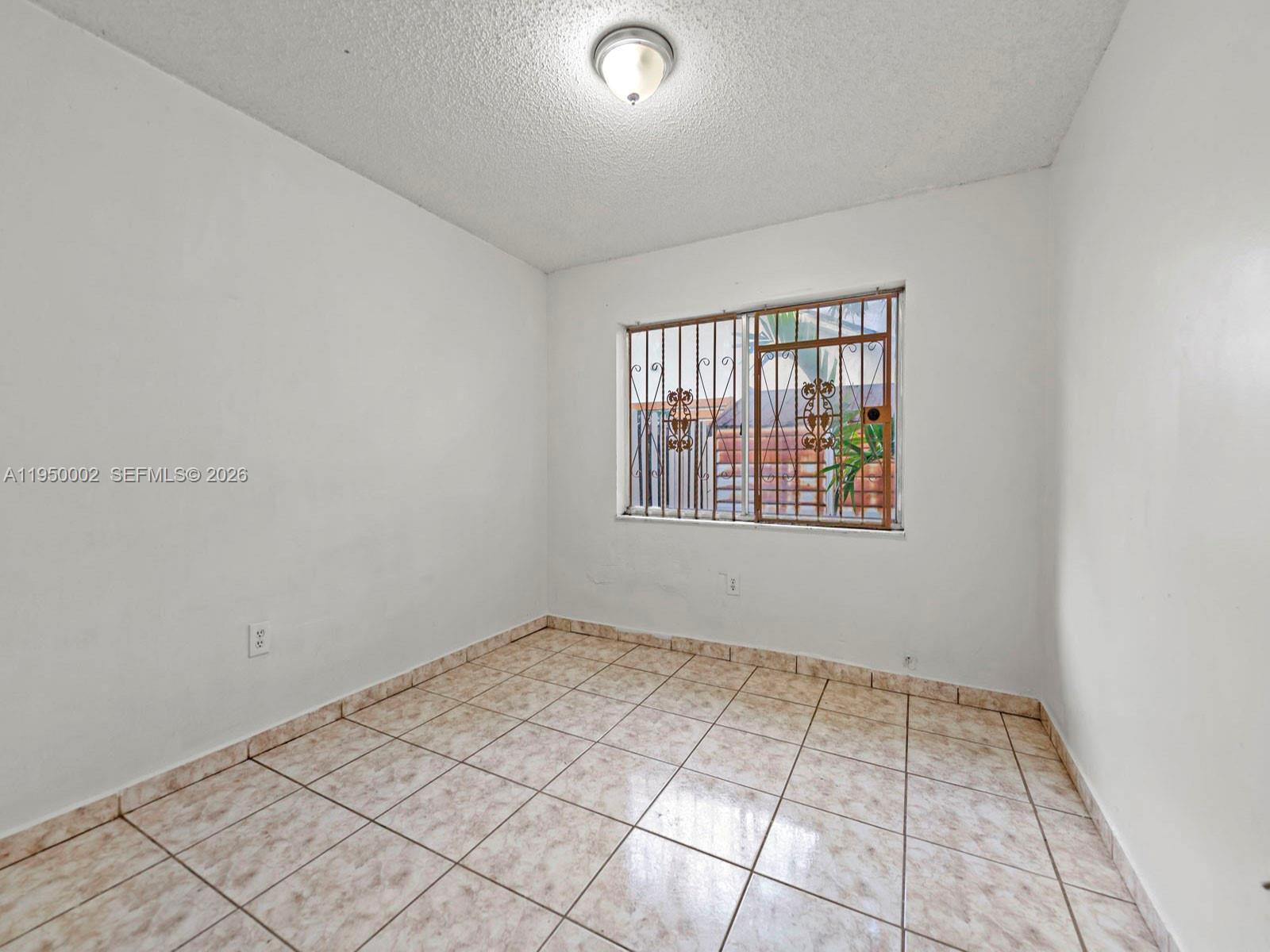 11075 Southwest 221st Terrace Miami, FL 33170 - Photo 14 of 31 an empty room with windows