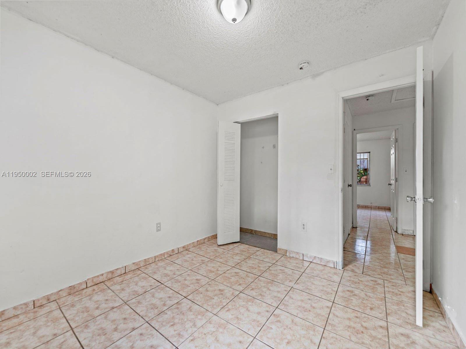 11075 Southwest 221st Terrace Miami, FL 33170 - Photo 17 of 31 a view of an empty room