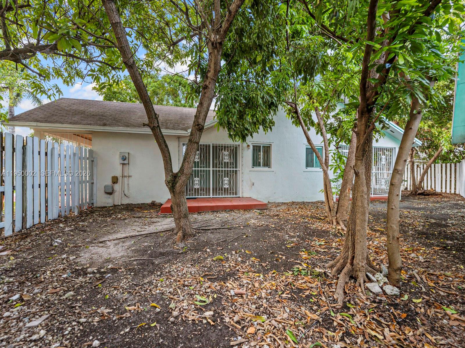 11075 Southwest 221st Terrace Miami, FL 33170 - Photo 21 of 31 a backyard of a house with lots of green space