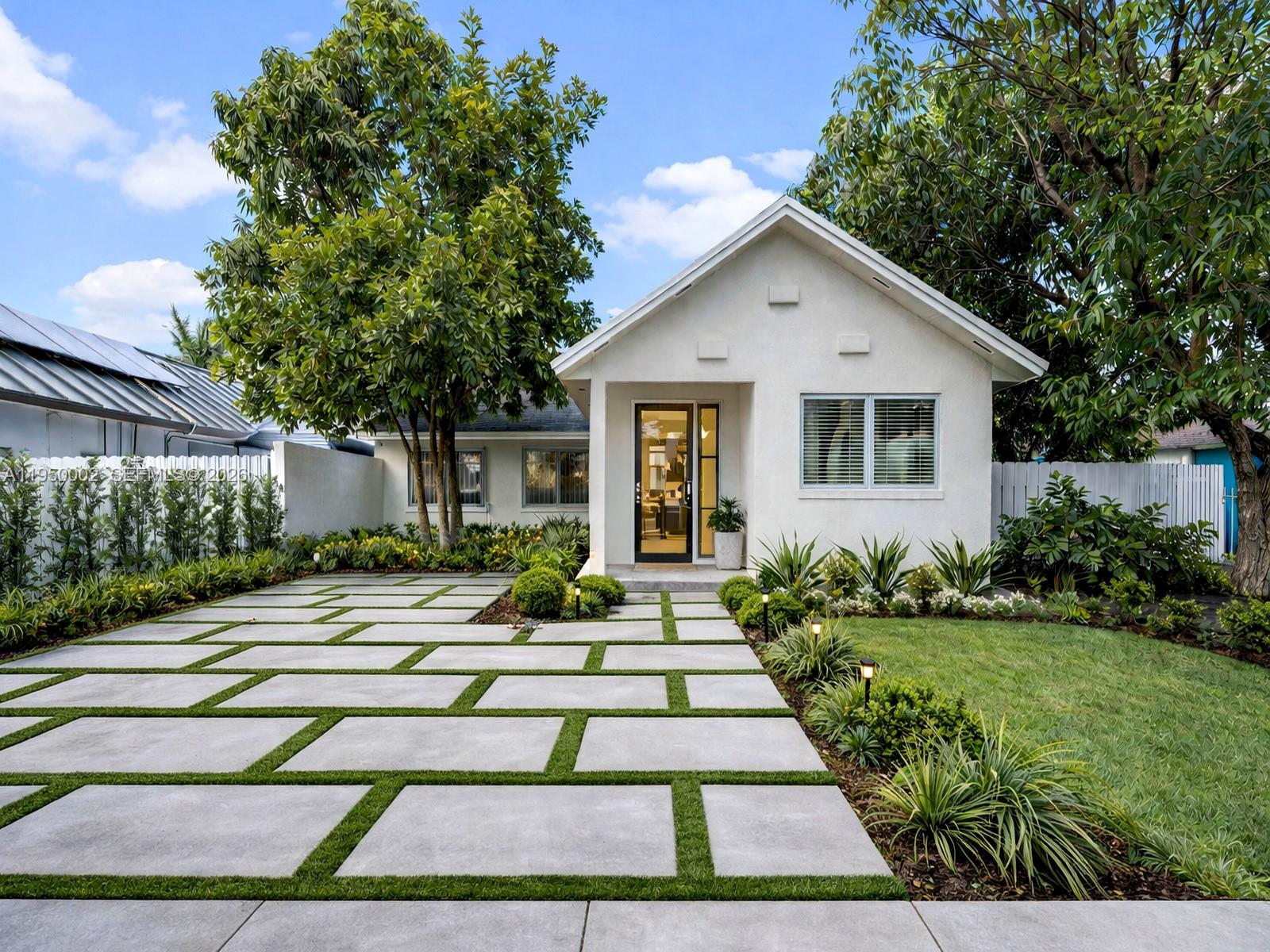 11075 Southwest 221st Terrace Miami, FL 33170 - Photo 25 of 31 a front view of a house with a yard