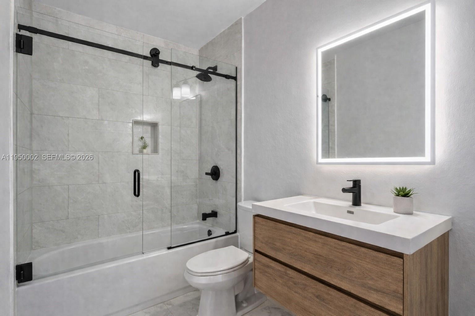 11075 Southwest 221st Terrace Miami, FL 33170 - Photo 29 of 31 a bathroom with a sink toilet and shower