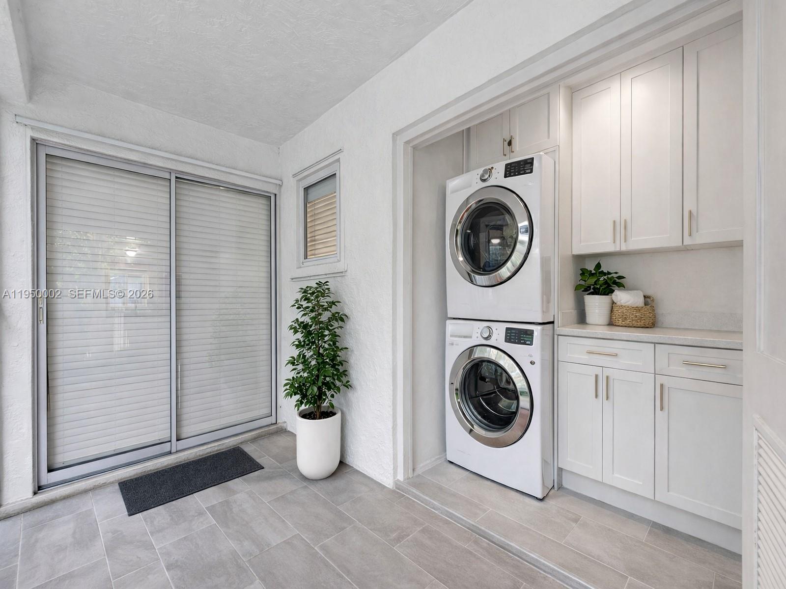 11075 Southwest 221st Terrace Miami, FL 33170 - Photo 30 of 31 a utility room with sink dryer and washer