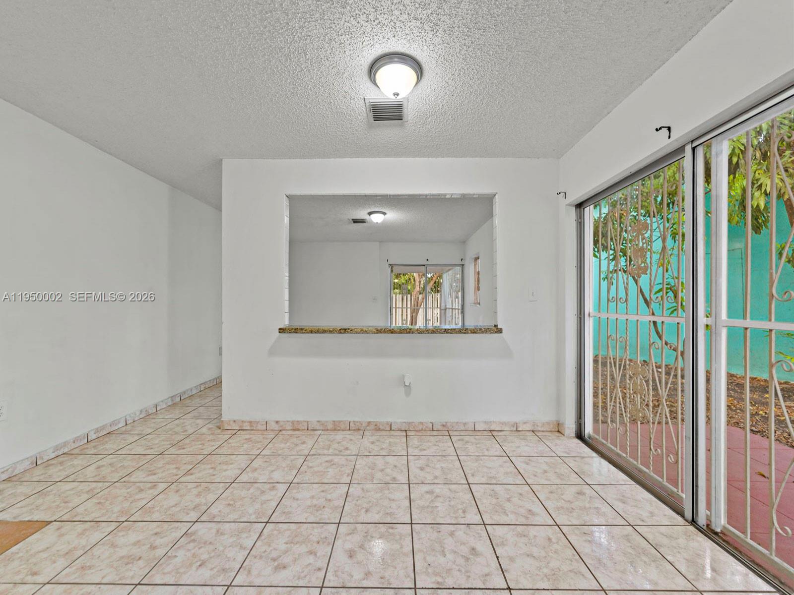 11075 Southwest 221st Terrace Miami, FL 33170 - Photo 4 of 31 a view of an entryway with wooden floor