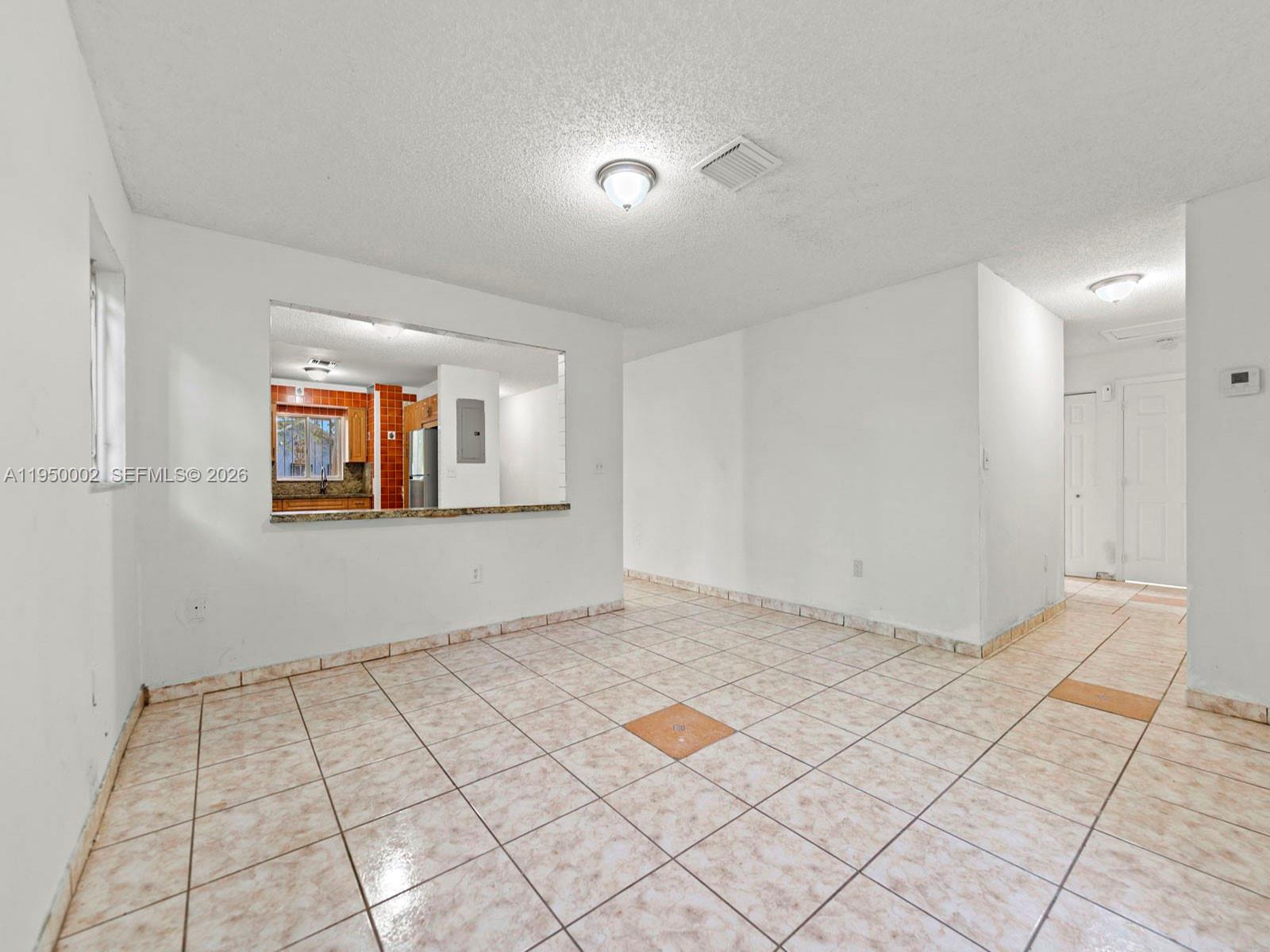 11075 Southwest 221st Terrace Miami, FL 33170 - Photo 6 of 31 a view of an empty room and window