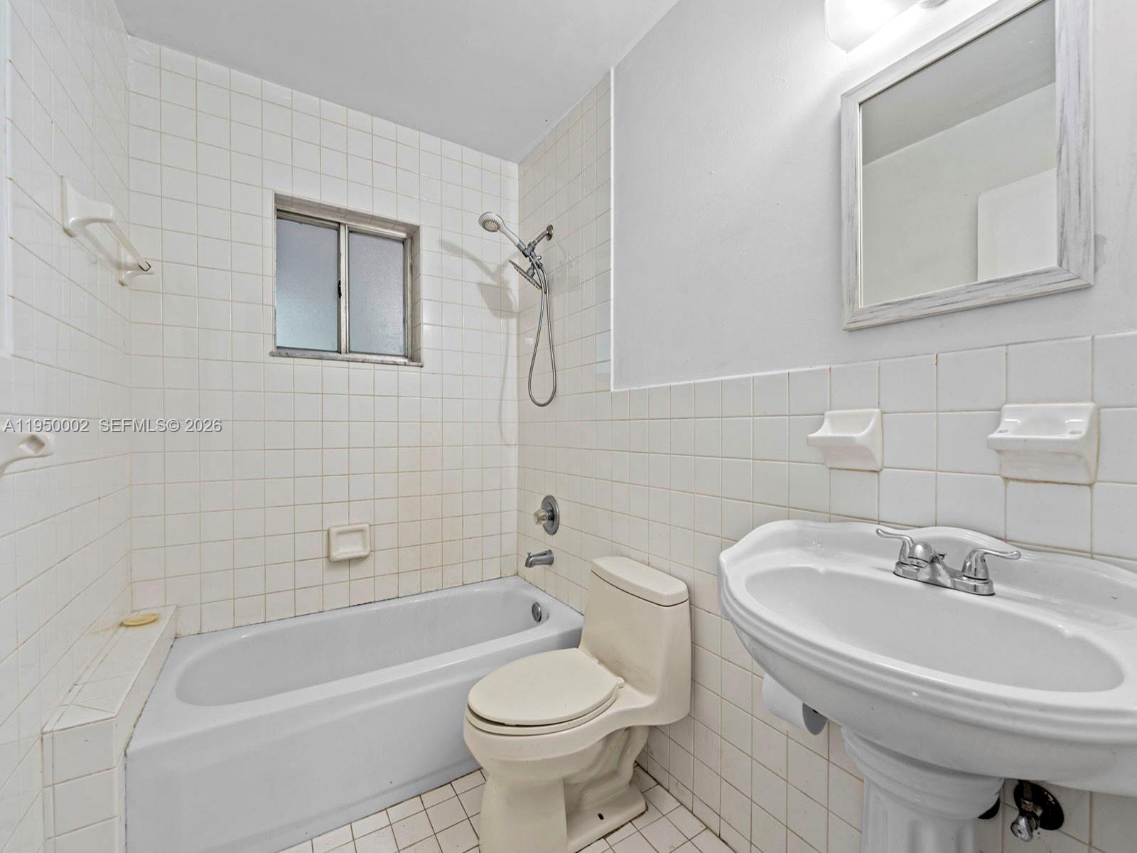 11075 Southwest 221st Terrace Miami, FL 33170 - Photo 10 of 31 a bathroom with a sink toilet and bathtub