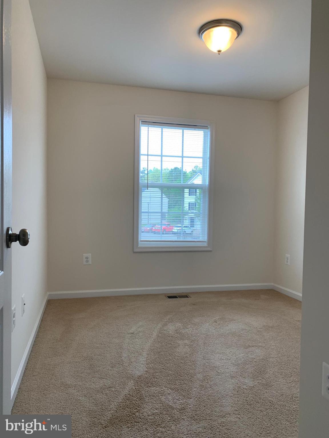 10421 Westgate Court Ruther Glen, VA 22546 - Photo 12 of 13 an empty room with windows