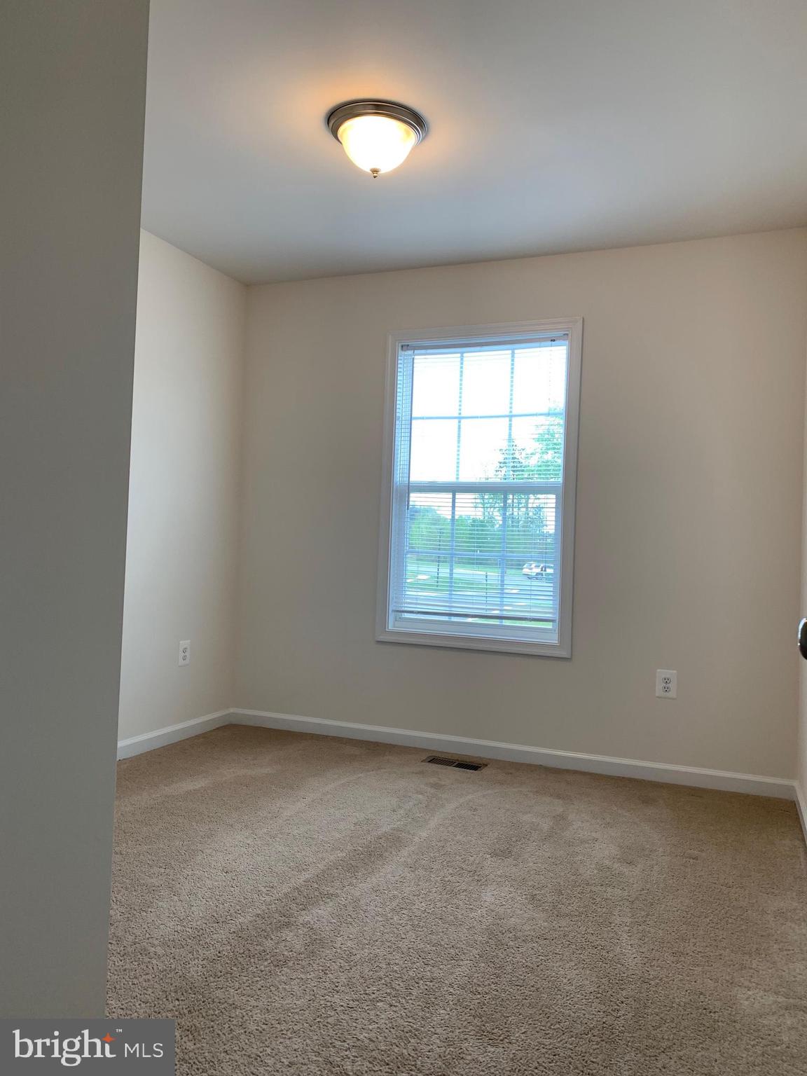 10421 Westgate Court Ruther Glen, VA 22546 - Photo 13 of 13 an empty room with a window