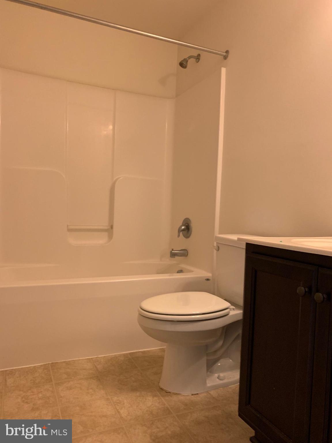 10421 Westgate Court Ruther Glen, VA 22546 - Photo 8 of 13 a bathroom with a sink a toilet and shower