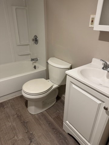 153 Union Street, Unit 1B Lawrence, MA 01841 - Photo 5 of 10 a white toilet sitting next to a bath tub