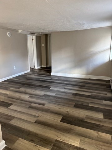 153 Union Street, Unit 1B Lawrence, MA 01841 - Photo 6 of 10 a view of livingroom and kitchen stairs