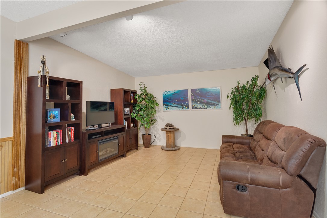 422 Del Monte Road Sebastian, FL 32958 - Photo 22 of 35 a living room with furniture and a flat screen tv