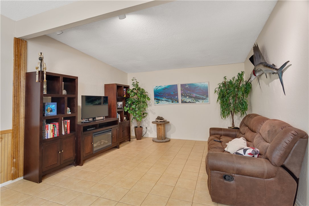 422 Del Monte Road Sebastian, FL 32958 - Photo 23 of 35 a living room with furniture and a flat screen tv