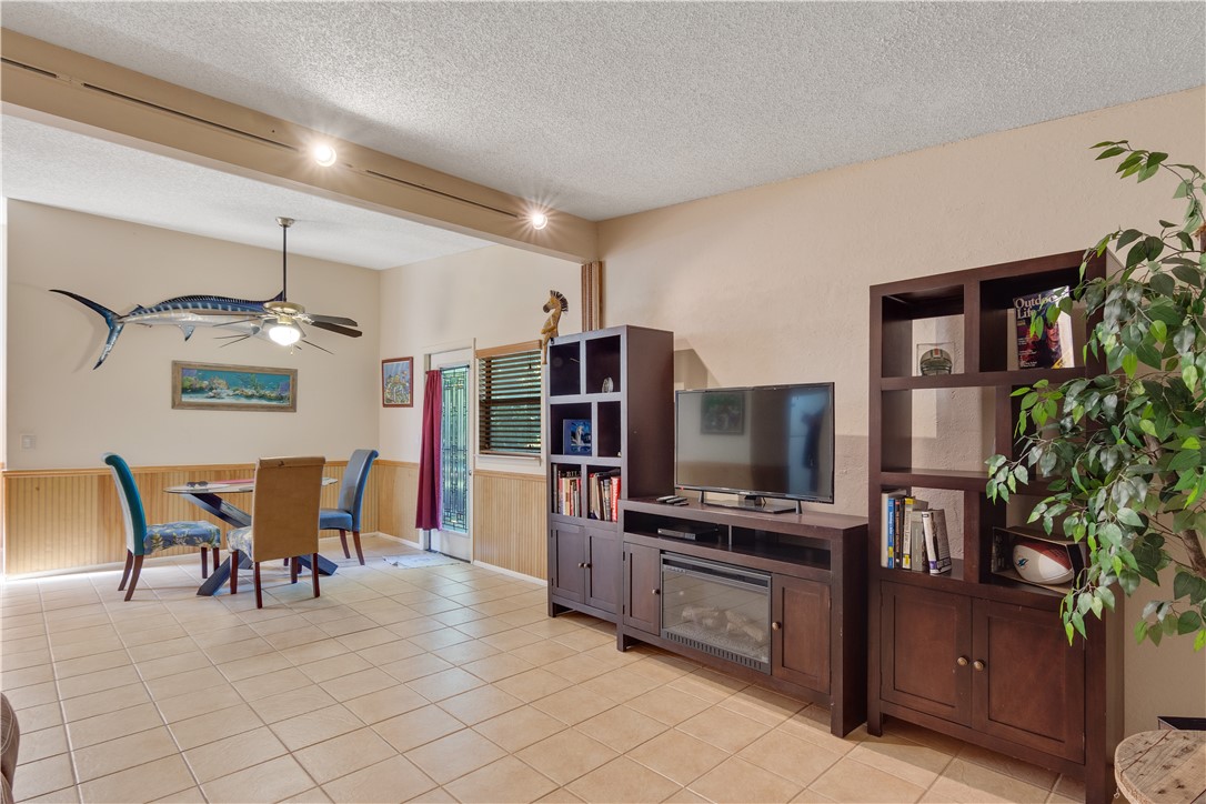 422 Del Monte Road Sebastian, FL 32958 - Photo 25 of 35 a view of kitchen with refrigerator stove dining table and chairs