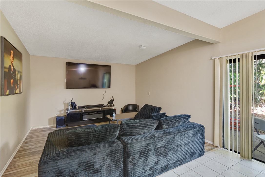 422 Del Monte Road Sebastian, FL 32958 - Photo 9 of 35 a living room with couches and a flat screen tv