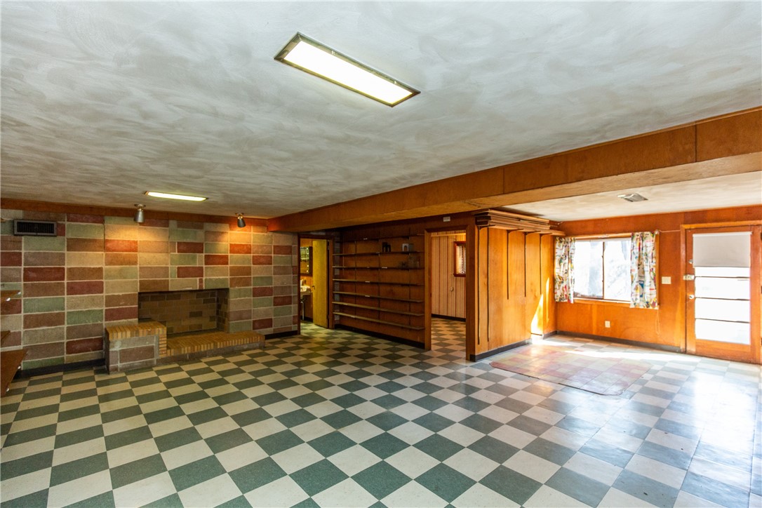 45 Amherst Road Cranston, RI 02920 - Photo 40 of 47 Above grade lower level has stunning fireplace and lots of natural light. A little updating and you have a 1500+sf living space!