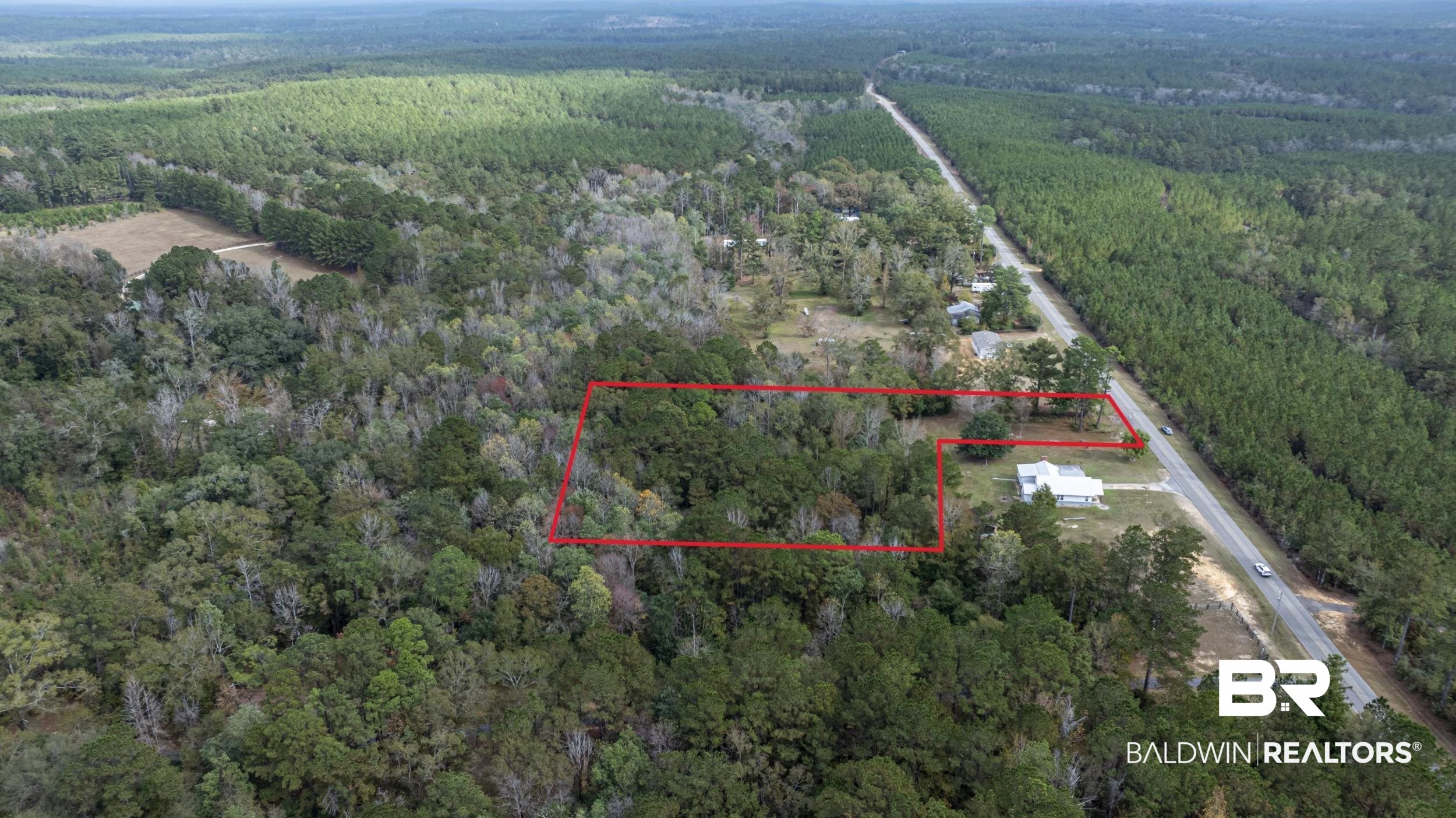 11753 Maytower Road Stockton, AL 36579 - Photo 7 of 8 Aerial view of property and surrounding area featuring a heavily wooded area and property boundaries highlighted