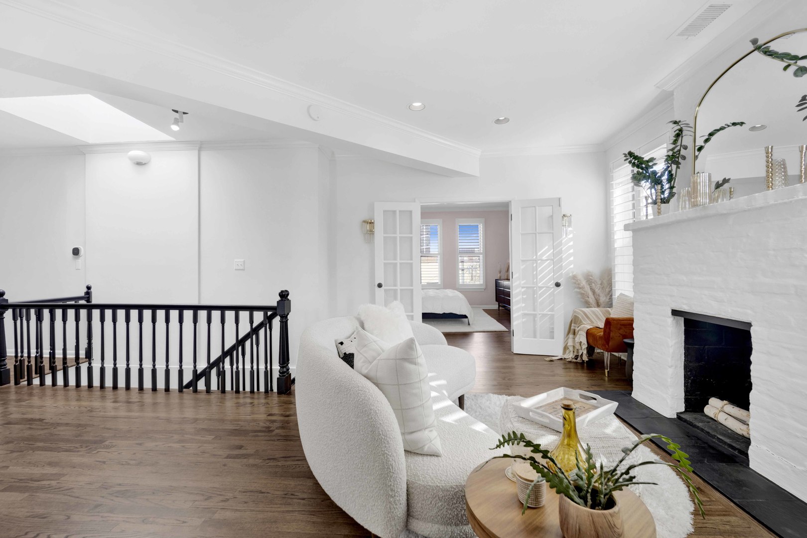 223 West Wisconsin Street, Unit 3A Chicago, IL 60614 - Photo 13 of 27 a living room with furniture a fireplace and a chandelier