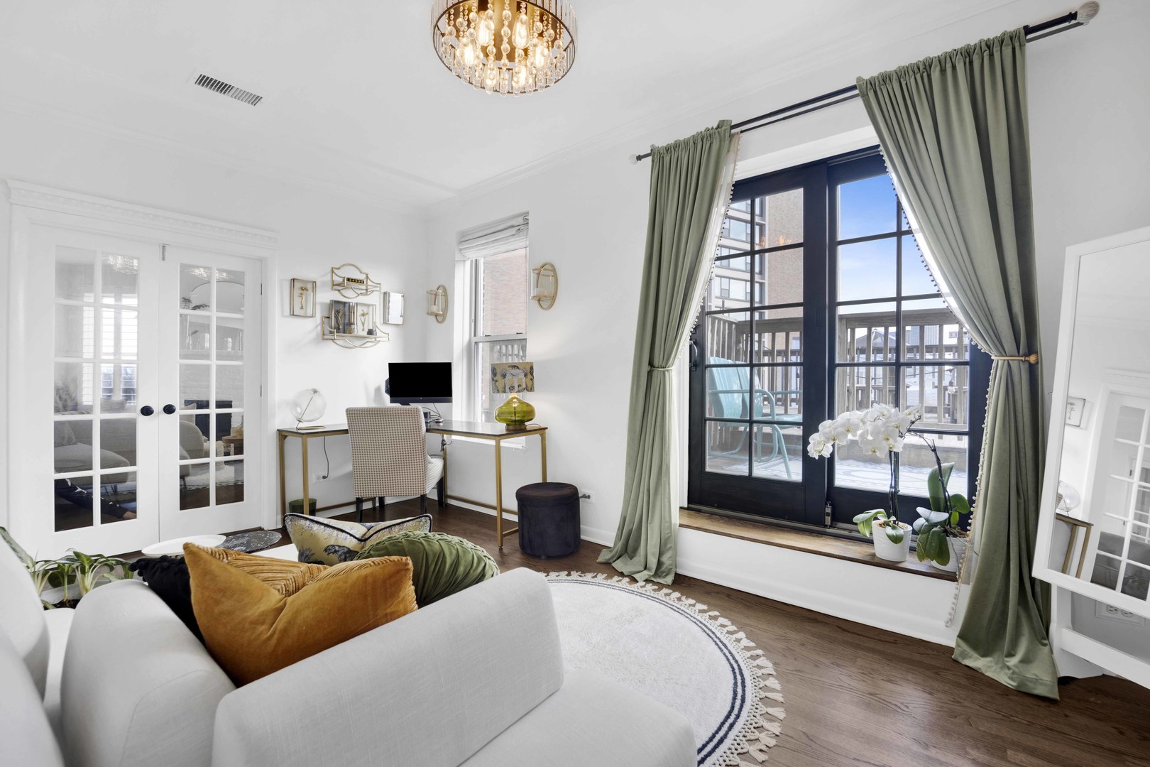 223 West Wisconsin Street, Unit 3A Chicago, IL 60614 - Photo 19 of 27 a living room with furniture and a floor to ceiling window