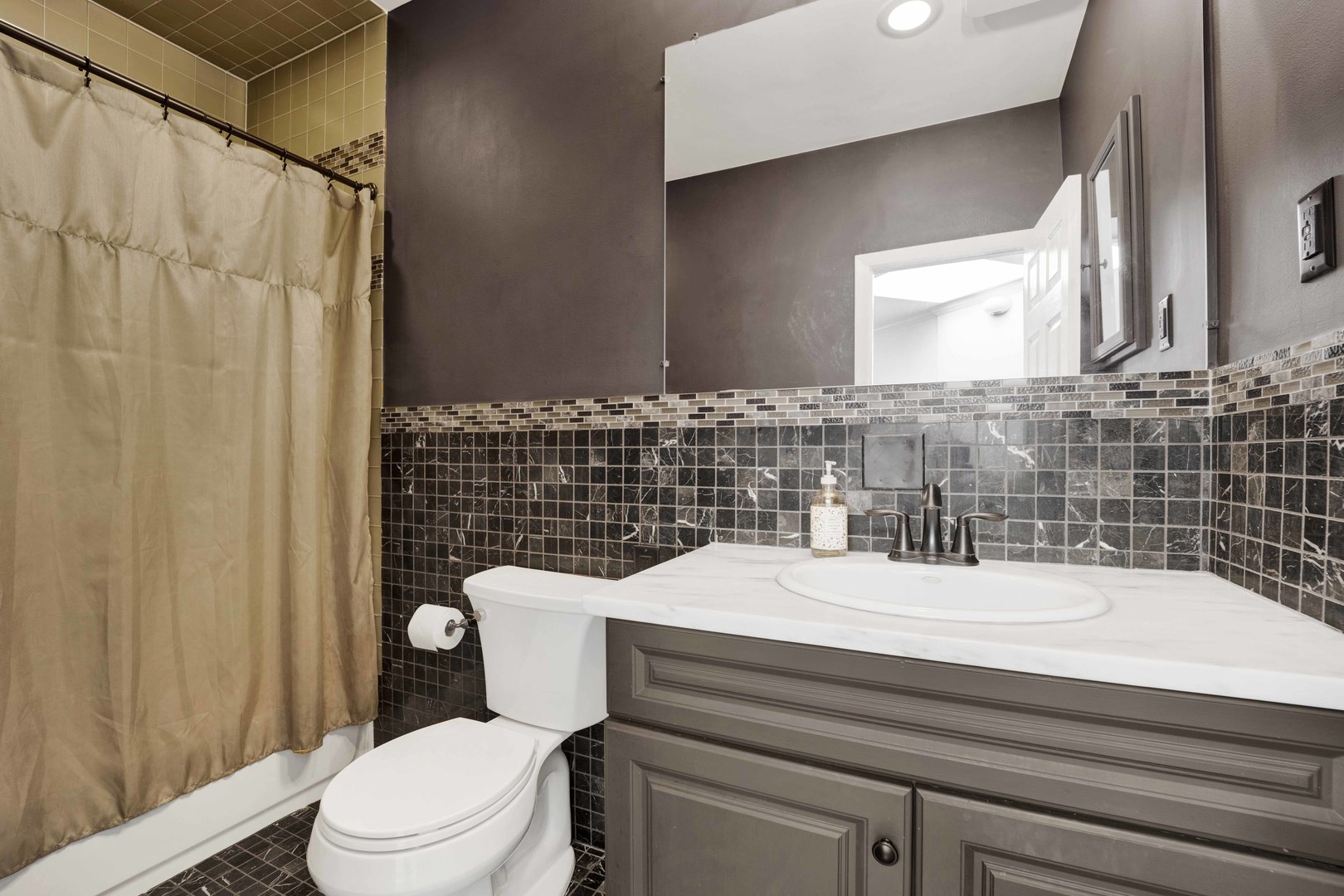 223 West Wisconsin Street, Unit 3A Chicago, IL 60614 - Photo 23 of 27 a bathroom with a sink a toilet and shower