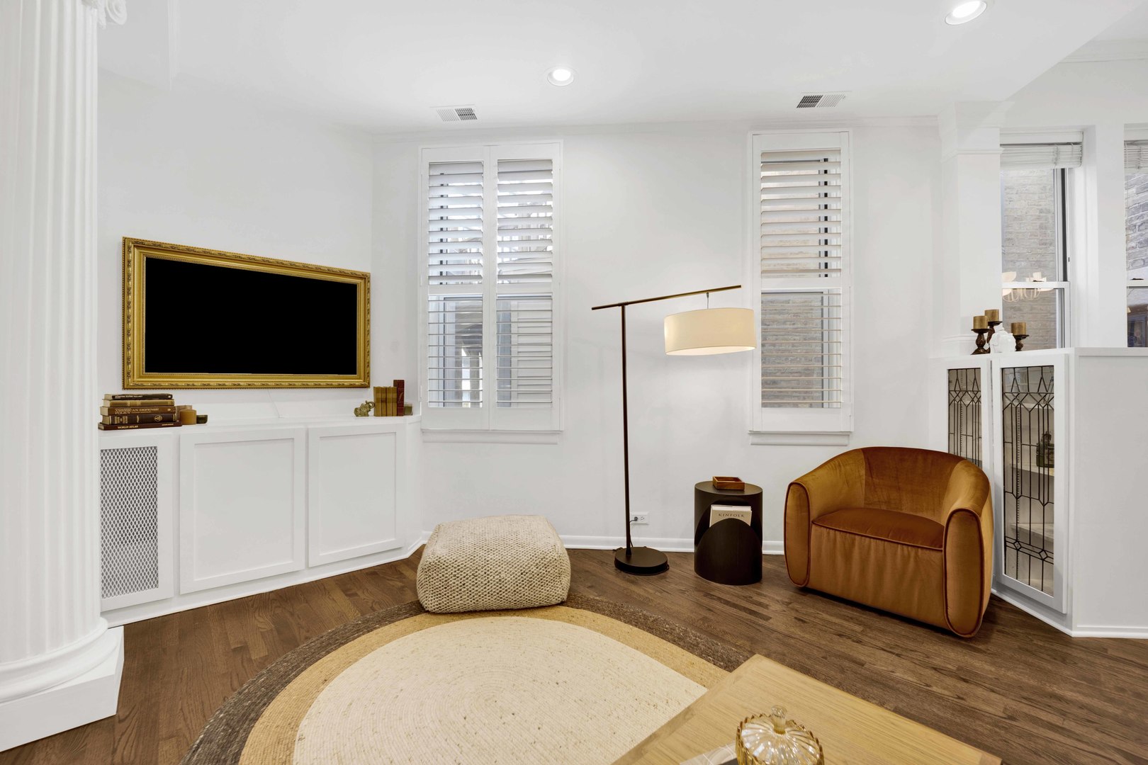 223 West Wisconsin Street, Unit 3A Chicago, IL 60614 - Photo 4 of 27 a bedroom with furniture and a flat screen tv