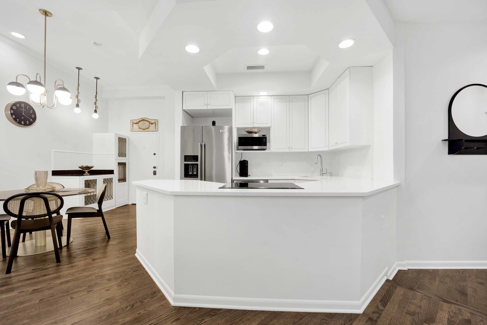 223 West Wisconsin Street, Unit 3A Chicago, IL 60614 - Photo 8 of 27 a kitchen with stainless steel appliances a table and chairs in it