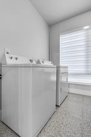 a view of cabinets with washer and dryer