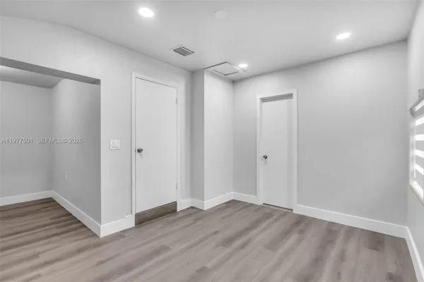 a view of entryway with wooden floor