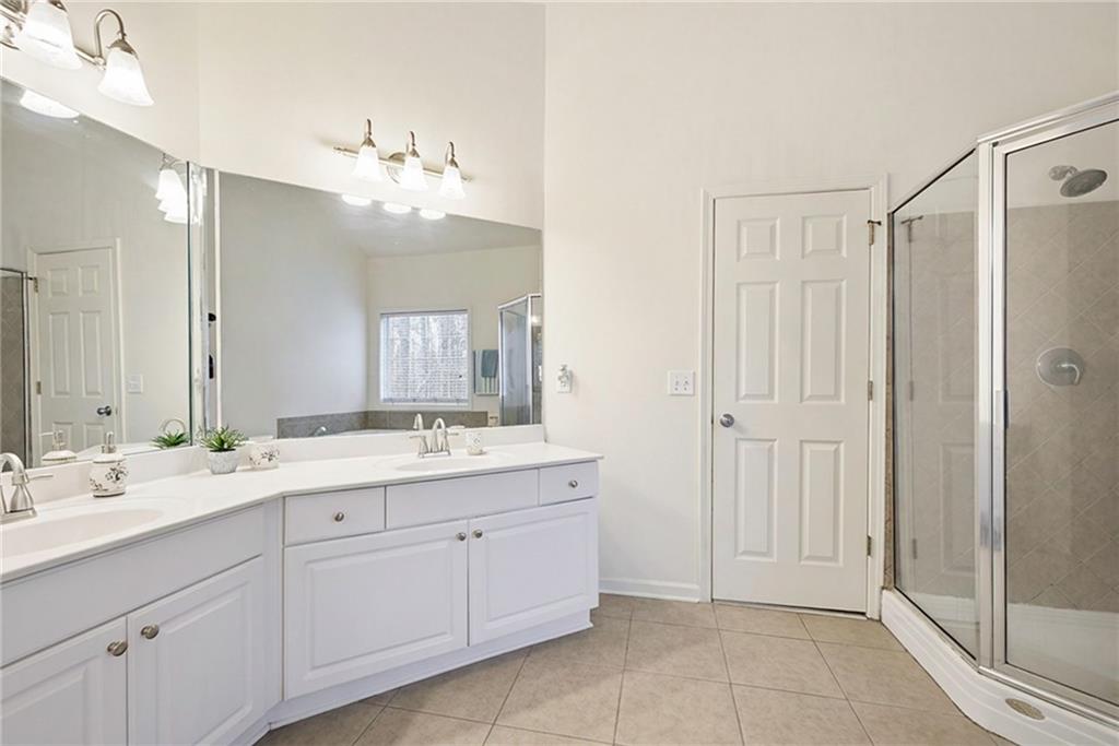 3155 Esplanade Circle Southwest Atlanta, GA 30311 - Photo 11 of 23 a bathroom with a double vanity sink and mirror