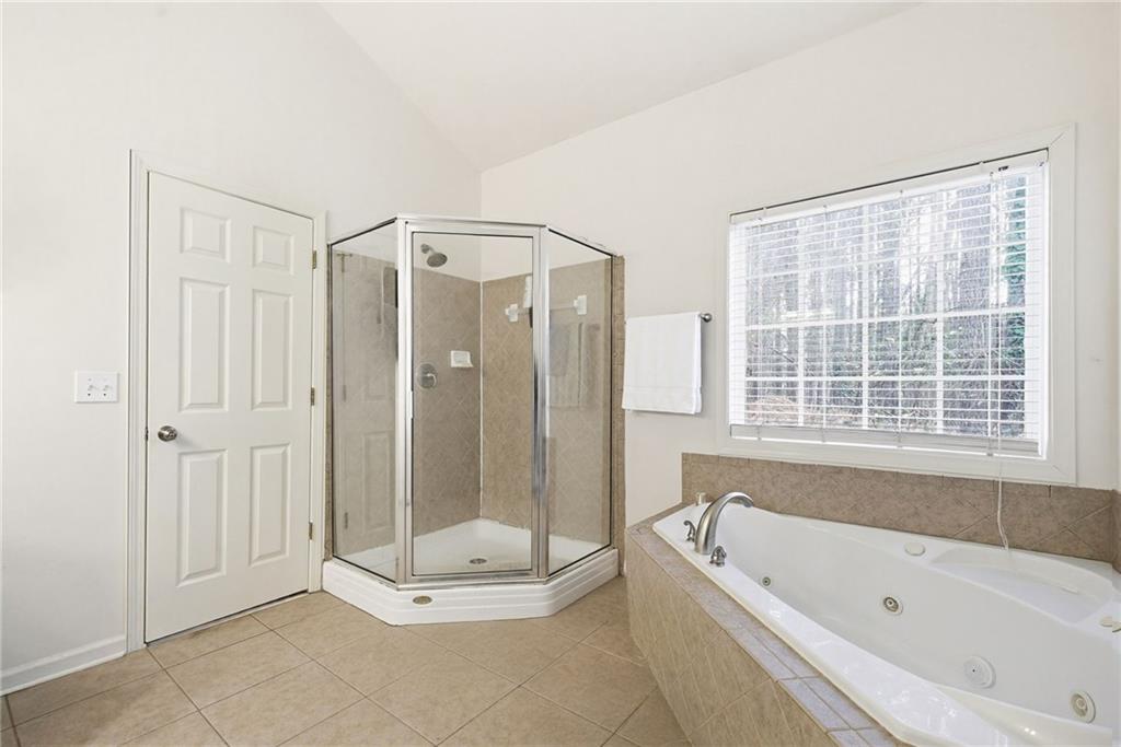 3155 Esplanade Circle Southwest Atlanta, GA 30311 - Photo 12 of 23 a bathroom with a bathtub a shower and a sink