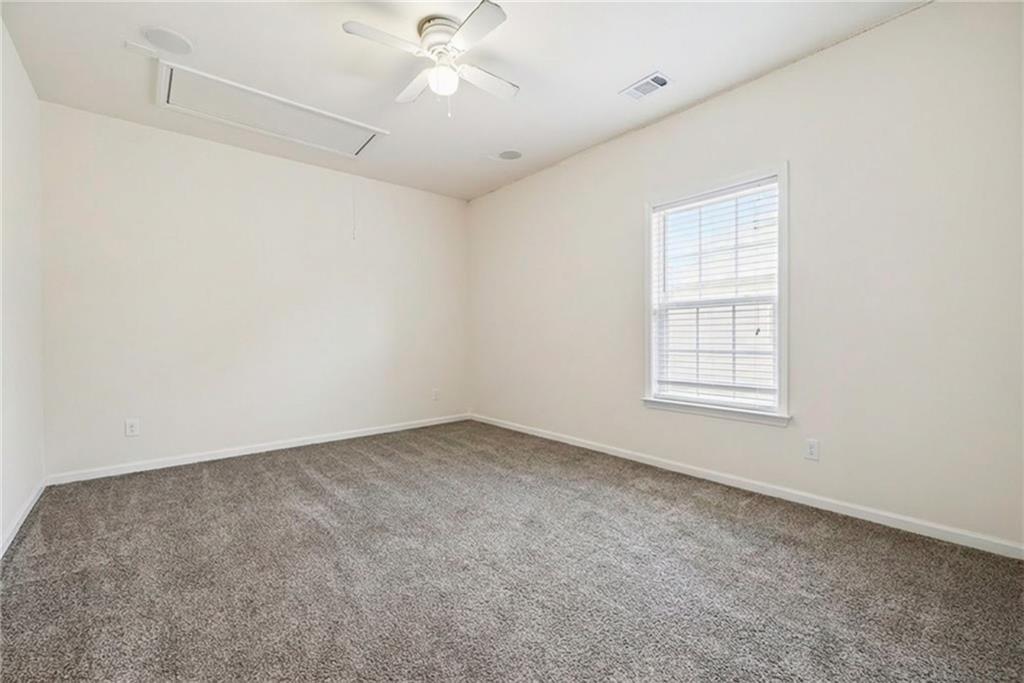 3155 Esplanade Circle Southwest Atlanta, GA 30311 - Photo 14 of 23 an empty room with a window and a ceiling fan
