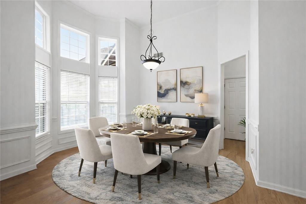 3155 Esplanade Circle Southwest Atlanta, GA 30311 - Photo 2 of 23 a dining room with furniture a chandelier and wooden floor