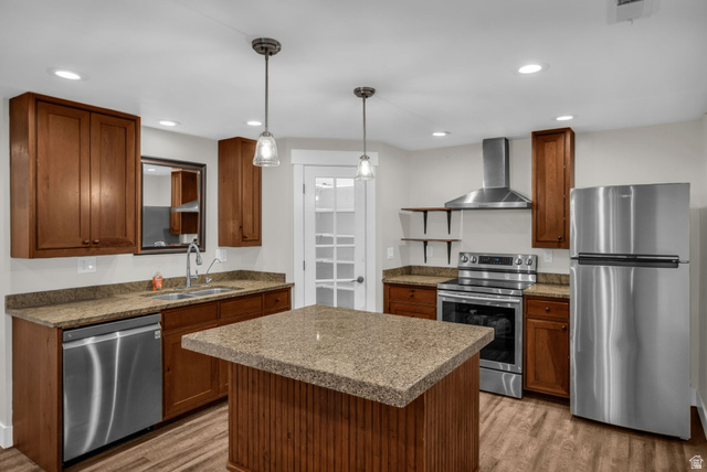 1836 West 800 North Mapleton, UT 84663 - Photo 22 of 38 Kitchen with stainless steel appliances, light wood-type flooring, wood finish cabinetry, and decorative light fixtures