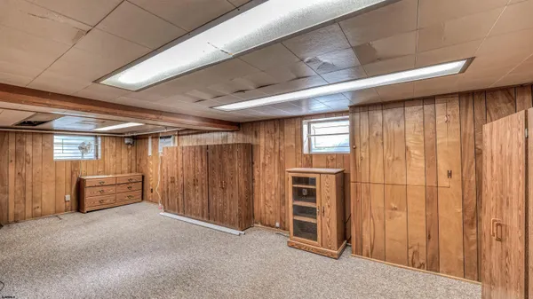 a view of an empty room with stairs