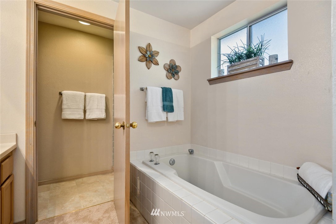 3225 208th Place Southeast Bothell, WA 98021 - Photo 15 of 28 a bathroom with a tub and shower