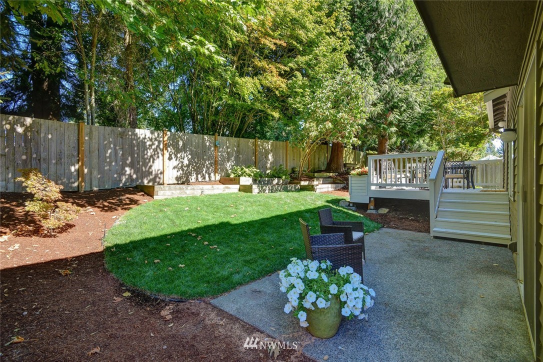 3225 208th Place Southeast Bothell, WA 98021 - Photo 21 of 28 a garden with trees in front of it
