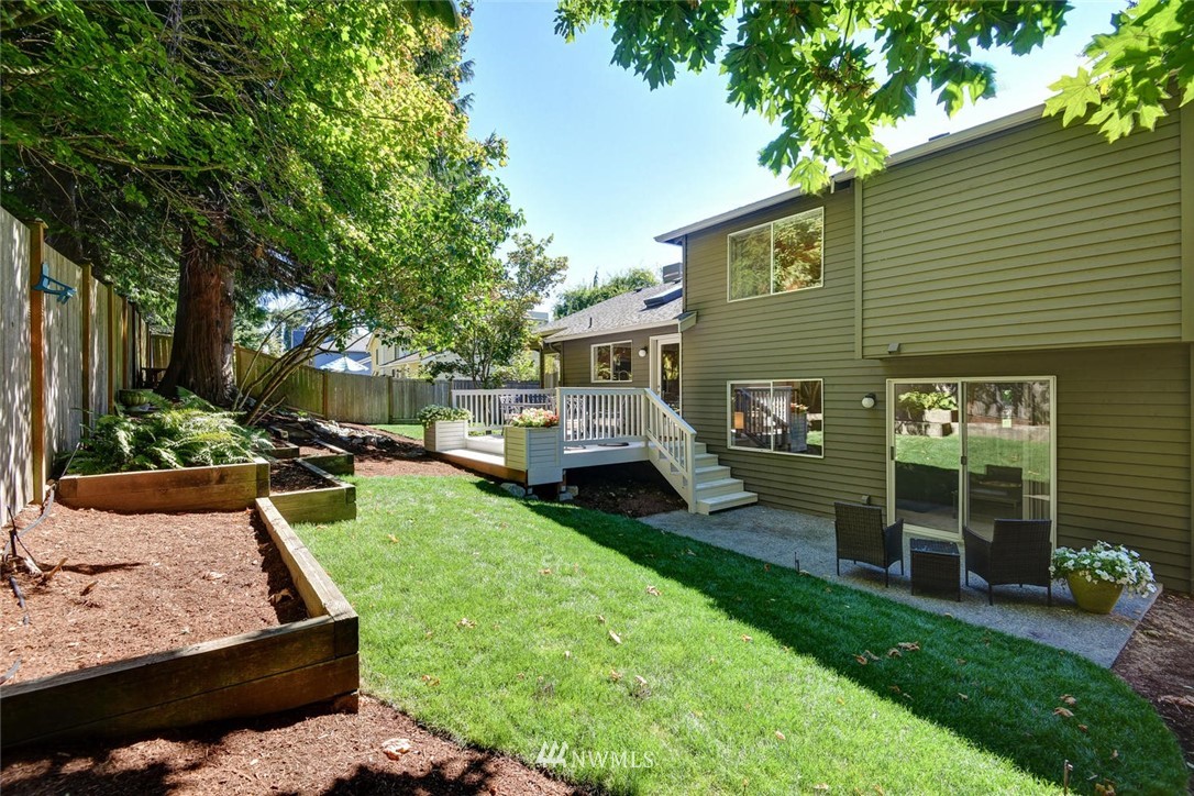 3225 208th Place Southeast Bothell, WA 98021 - Photo 22 of 28 a front view of a house with garden