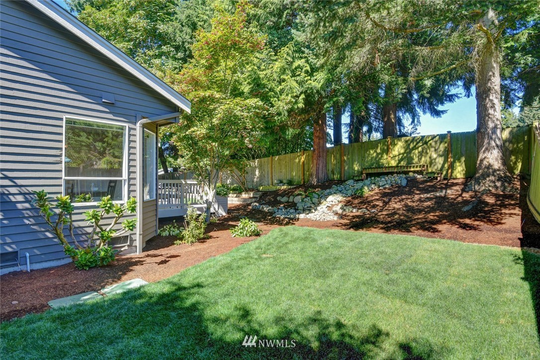 3225 208th Place Southeast Bothell, WA 98021 - Photo 26 of 28 a view of a chair and table in backyard of the house