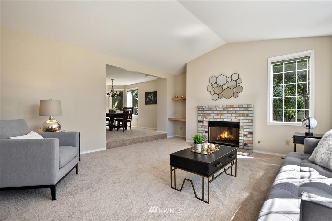 3225 208th Place Southeast Bothell, WA 98021 - Photo 4 of 28 a living room with furniture and a fireplace