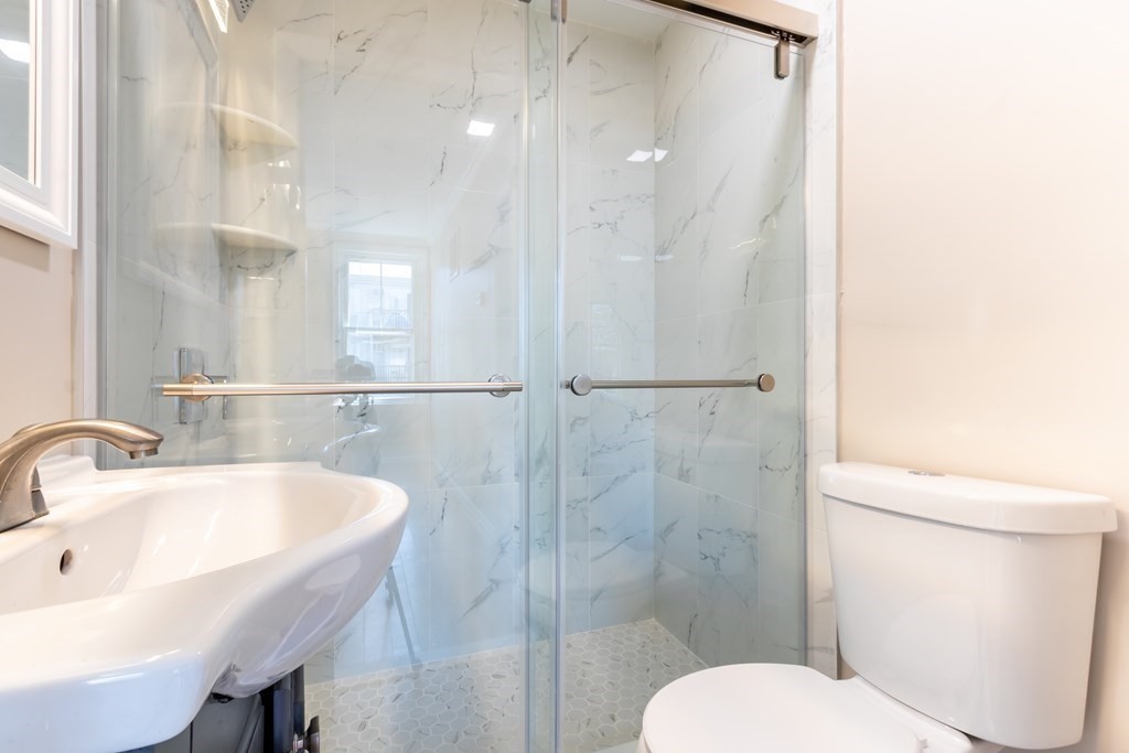 59-61 Division Street Chelsea, MA 02150 - Photo 4 of 13 a bathroom with a sink toilet and shower