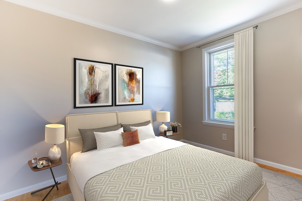 59-61 Division Street Chelsea, MA 02150 - Photo 6 of 13 a bedroom with a bed and a window