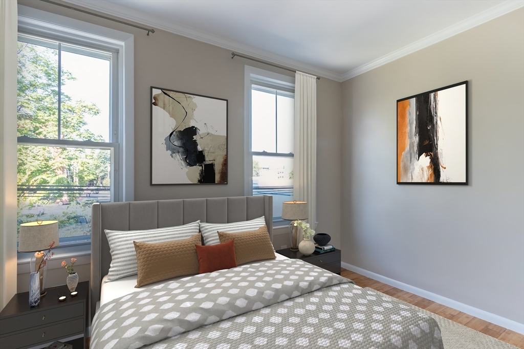 59-61 Division Street Chelsea, MA 02150 - Photo 7 of 13 a bedroom with a large bed and a window