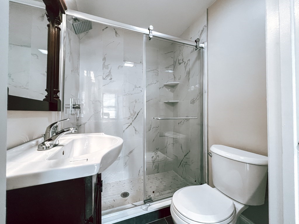 59-61 Division Street Chelsea, MA 02150 - Photo 9 of 13 a bathroom with a sink toilet and shower