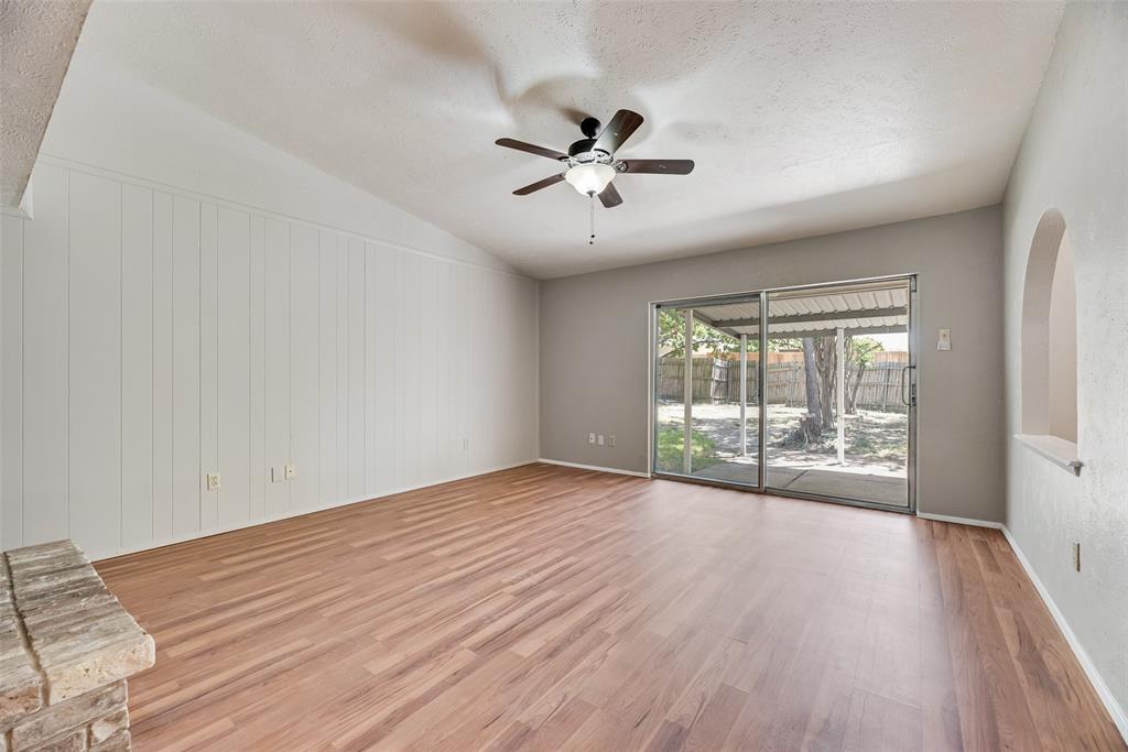 2002 Rose Hill Road Carrollton, TX 75007 - Photo 5 of 34 wooden floor in an empty room with a window