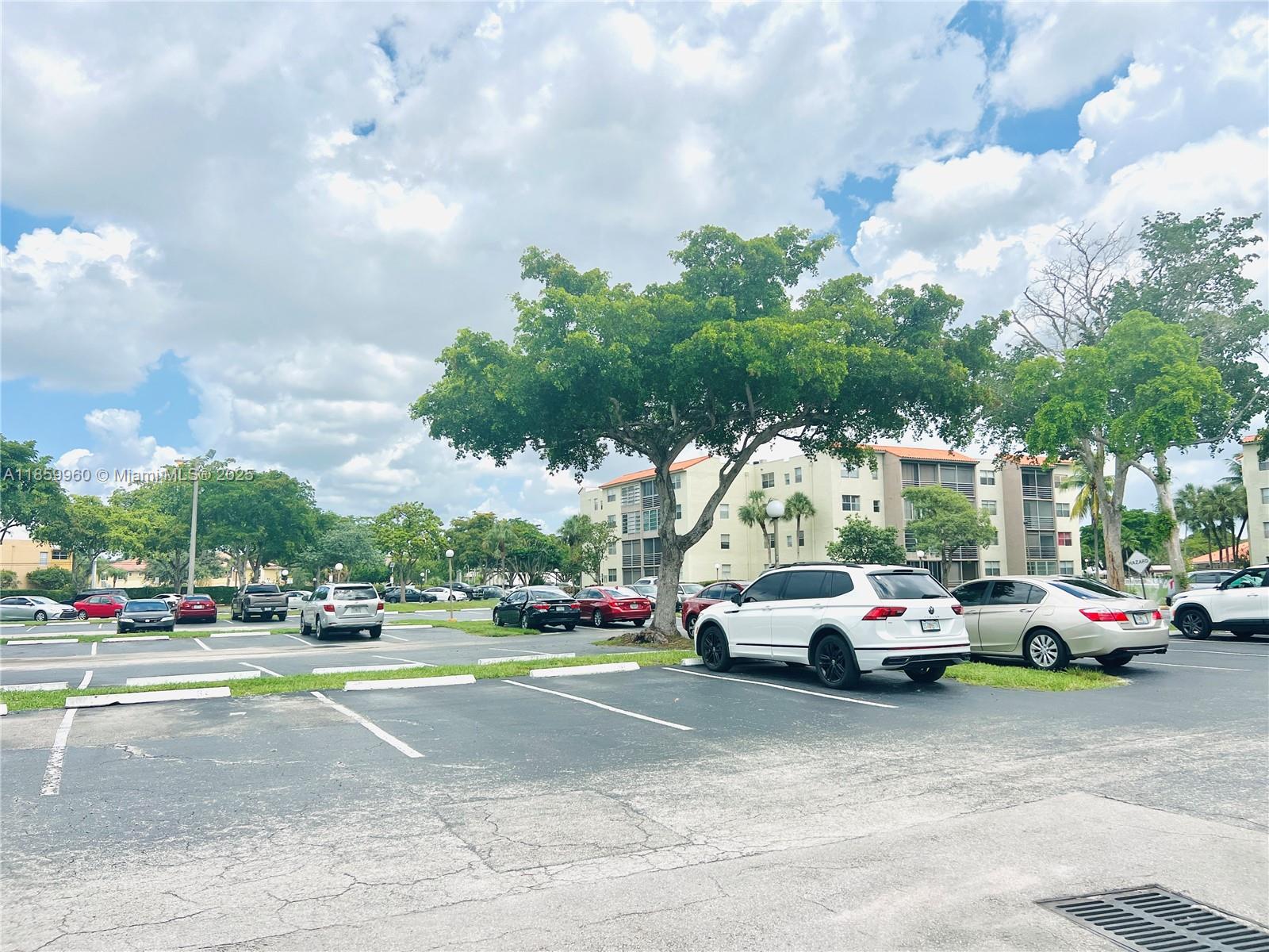 1810 Southwest 81st Avenue, Unit 2201 North Lauderdale, FL 33068 - Photo 12 of 32 a view of cars parked on the side of a street