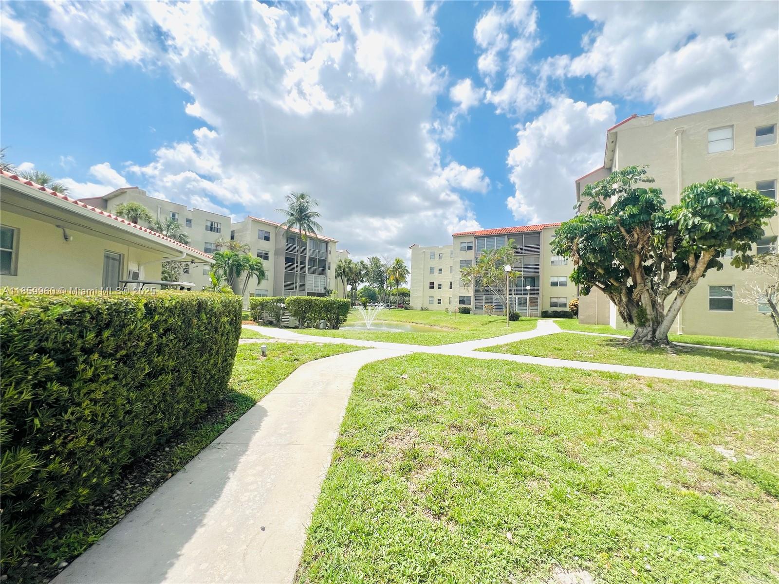 1810 Southwest 81st Avenue, Unit 2201 North Lauderdale, FL 33068 - Photo 13 of 32 a view of building with yard